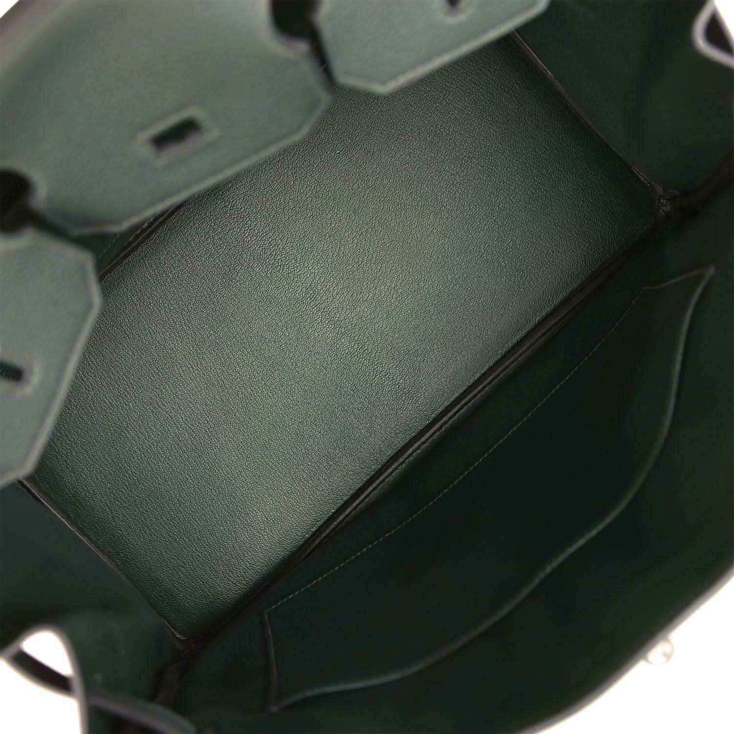 Dark green Togo leather handbag interior panel with smooth lining and side seam