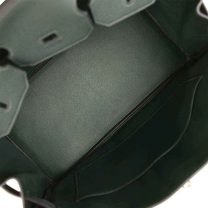 Dark green Togo leather handbag interior panel with smooth lining and side seam