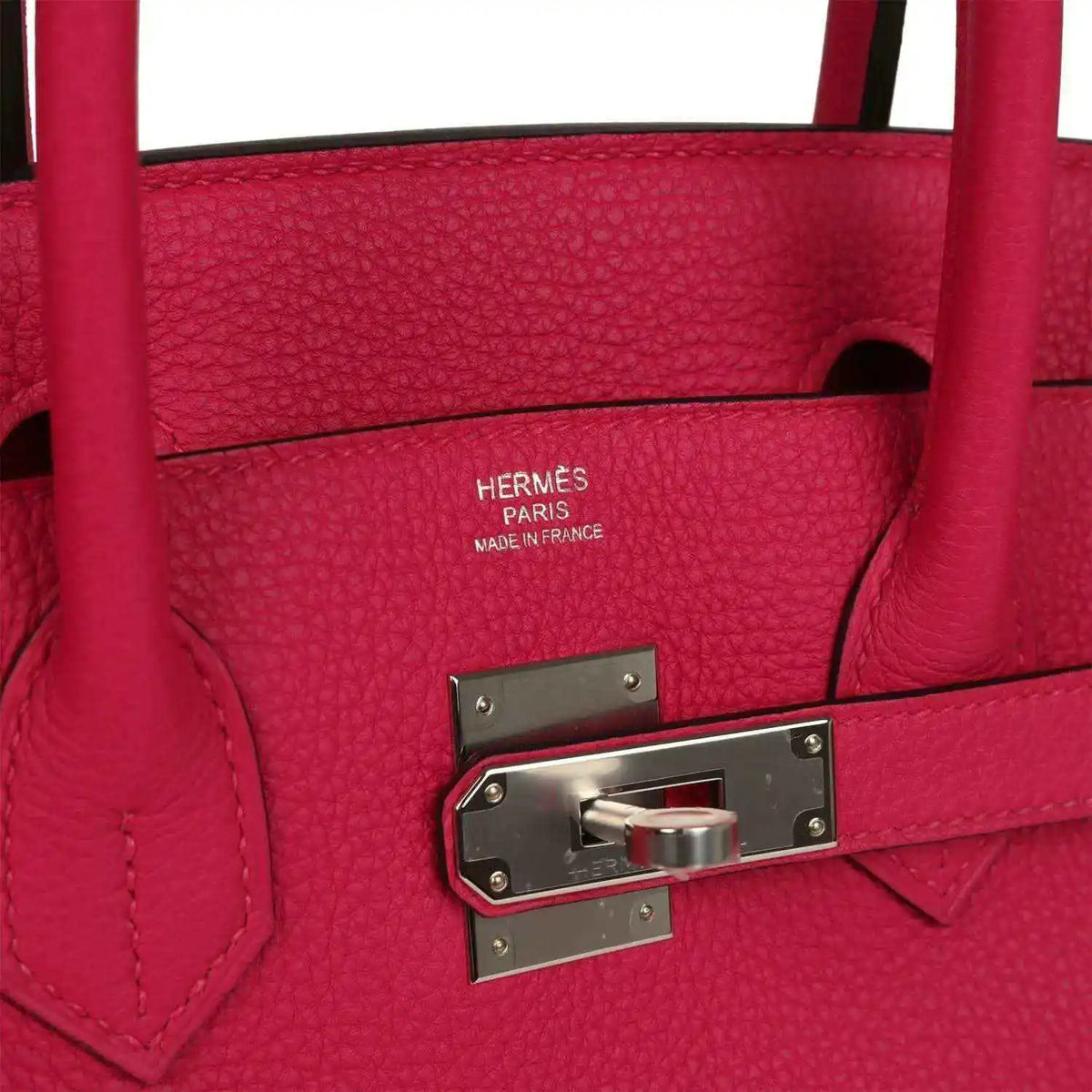 Hermes Birkin 30 leather handbag close-up: lock plate and rose pink leather stitching