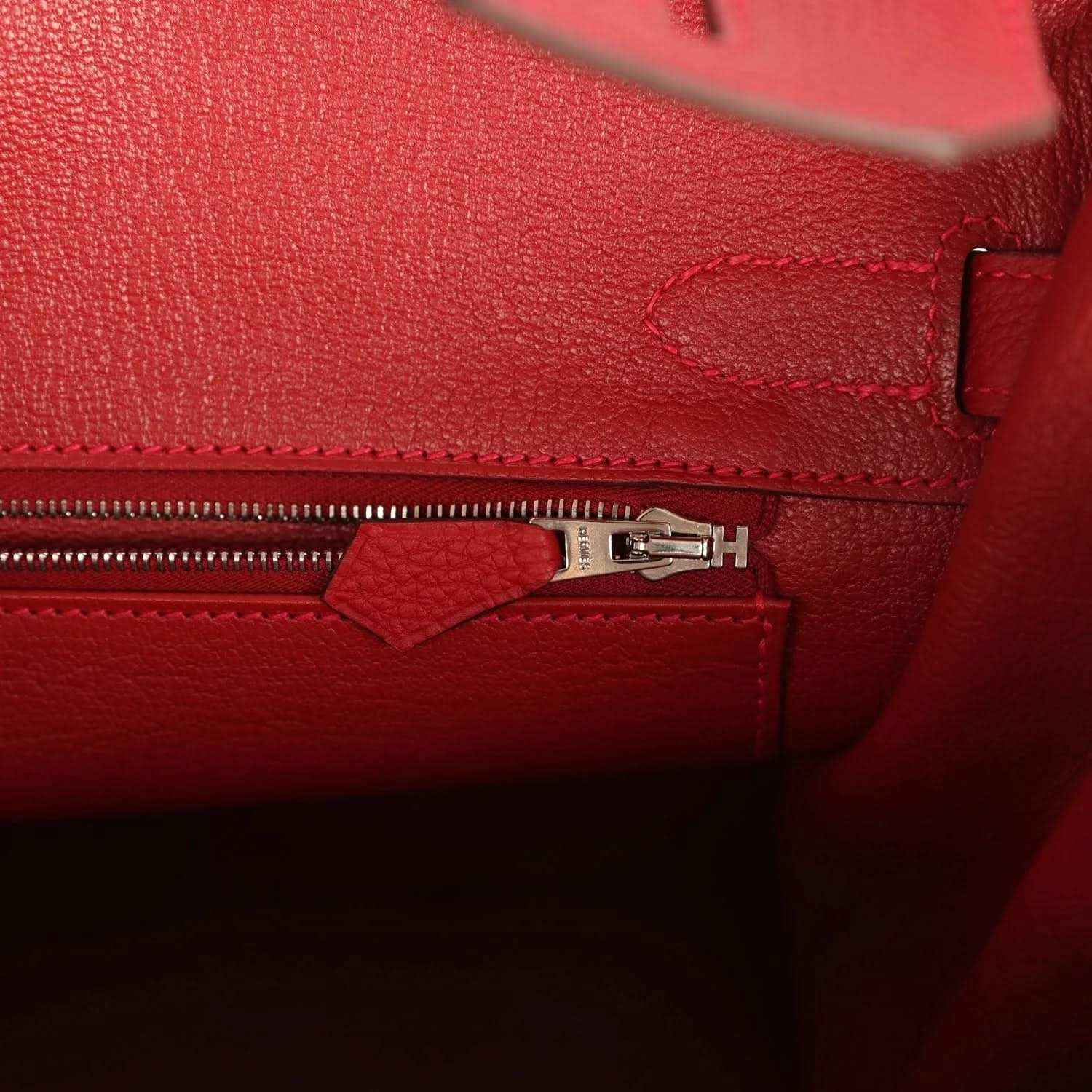 Hermes Birkin red Togo leather interior with zipper pull and hardware detail