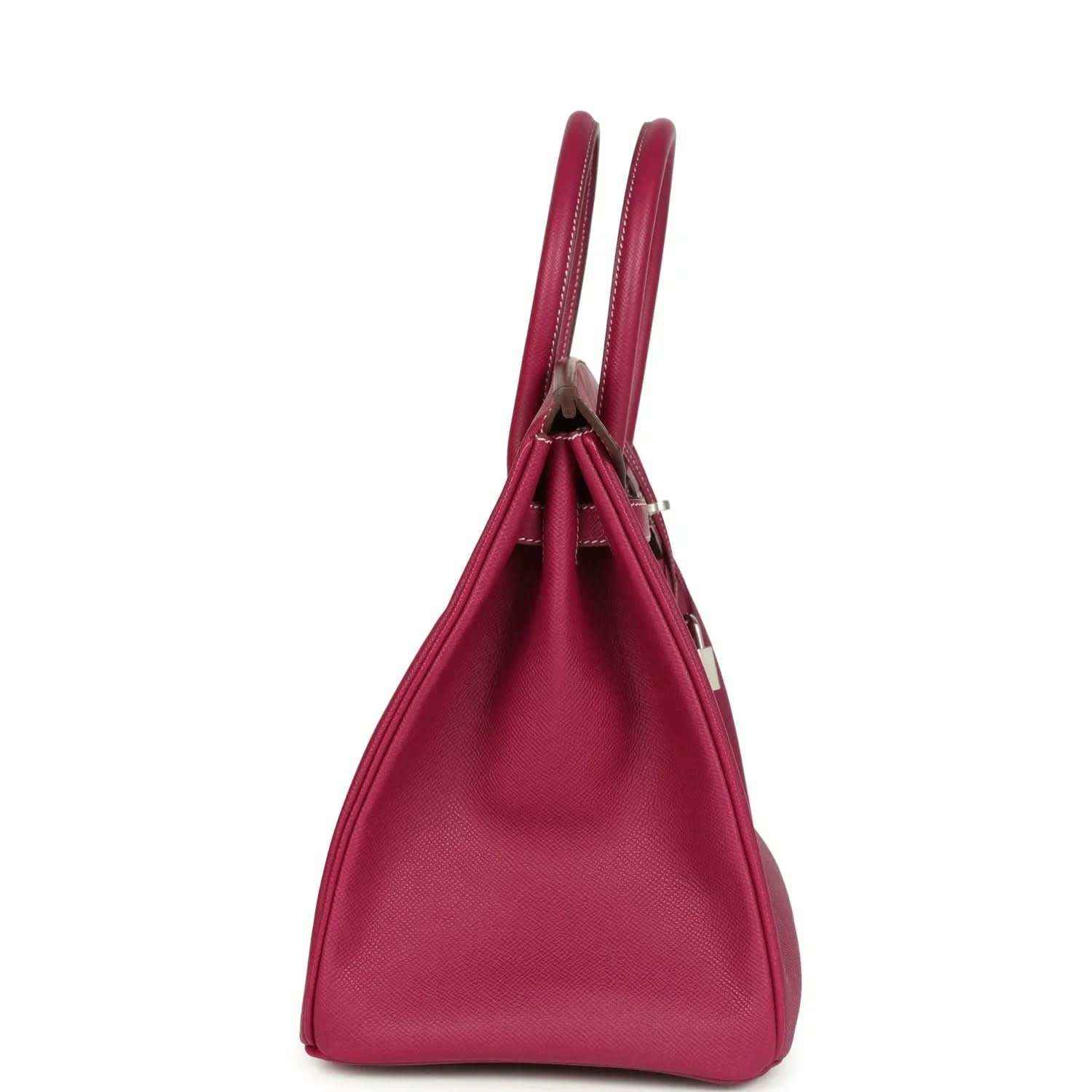 Pink Epsom leather handbag with two rolled top handles, shown in side profile.