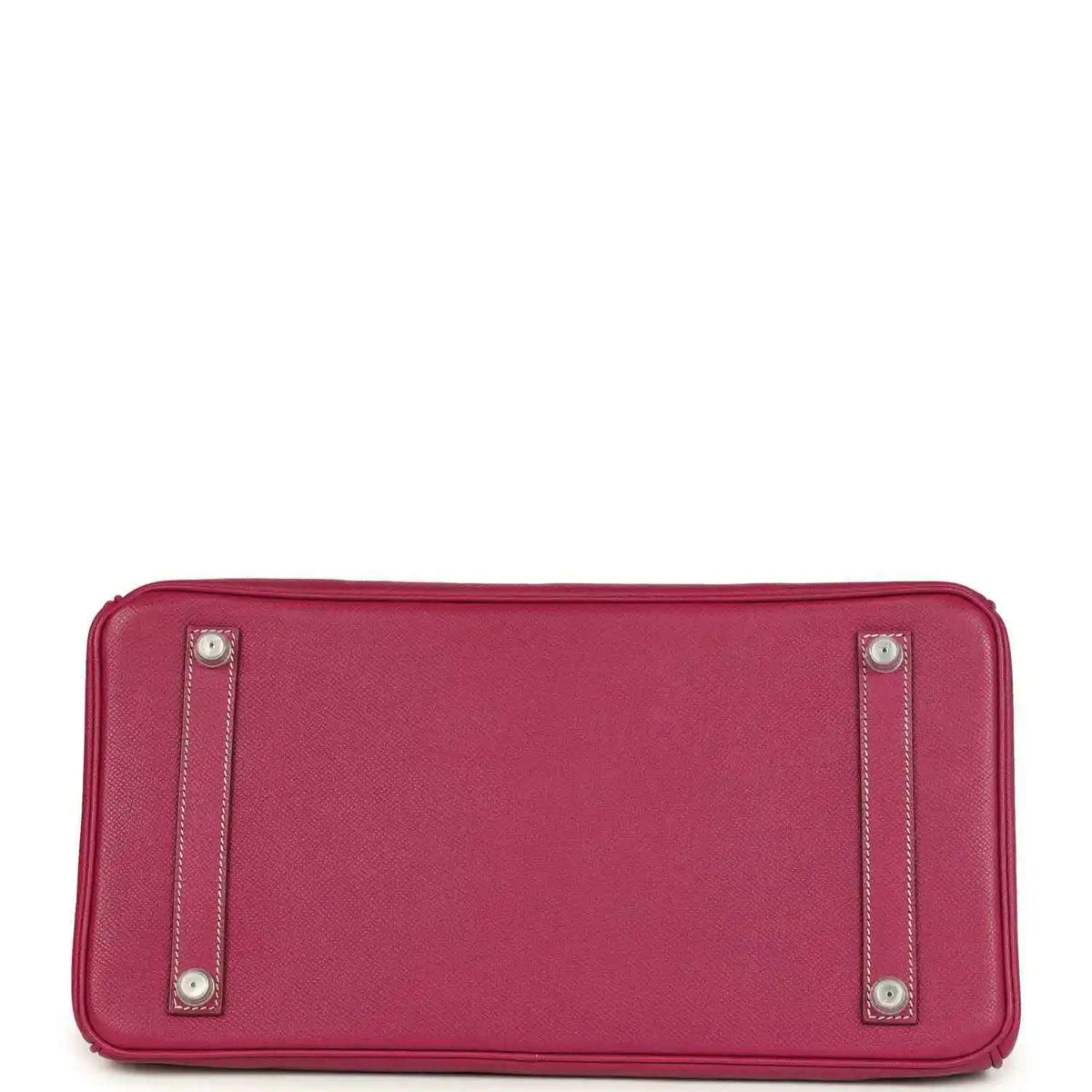 Pink Epsom leather handbag bottom with four protective studs and stitched edging.