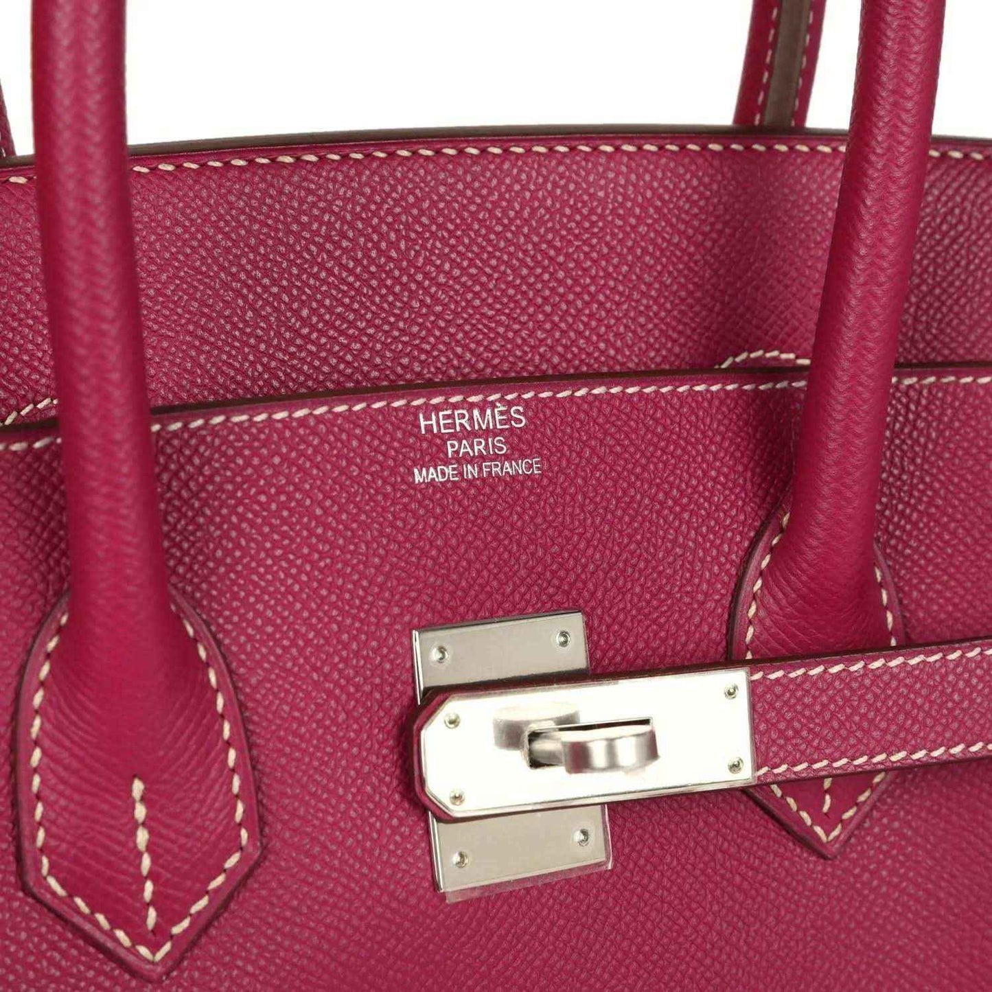 Pink Epsom leather handbag interior with Hermes Paris Made in France stamp and metal clasp.