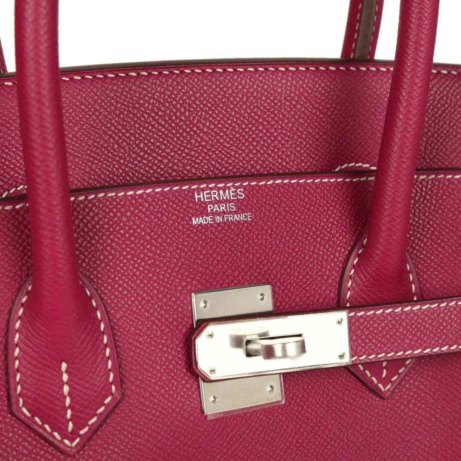 Pink Epsom leather handbag interior with Hermes Paris Made in France stamp and metal clasp.