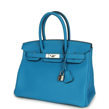 Blue leather Birkin-style handbag with front flap, lock clasp and hanging key charm