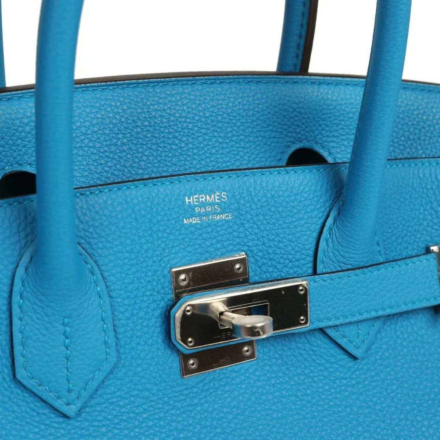 Hermes leather handbag front lock plate with engraved hinges and blue leather frame