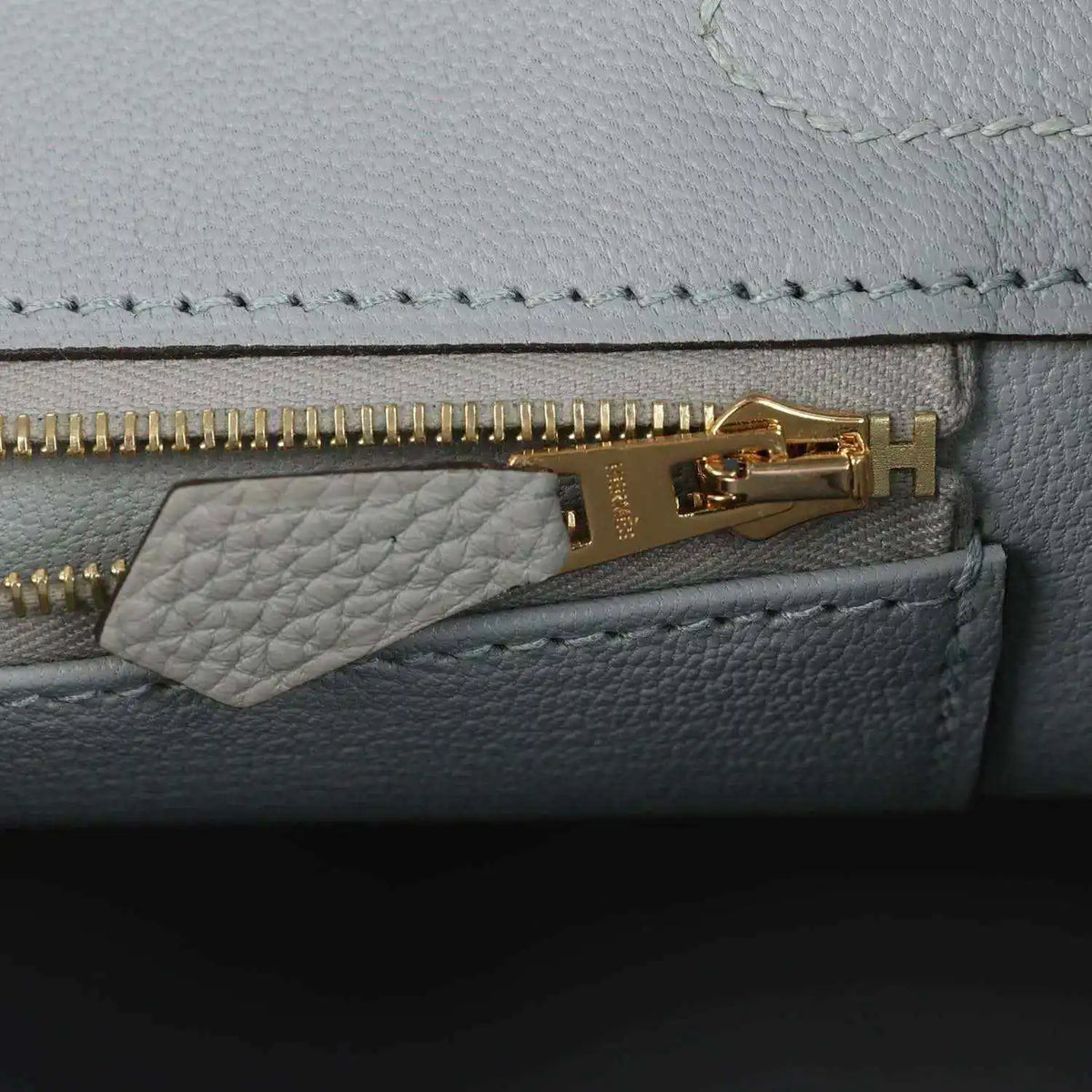 Light blue Togo leather Birkin 30 close-up: gold zipper track and zipper pull