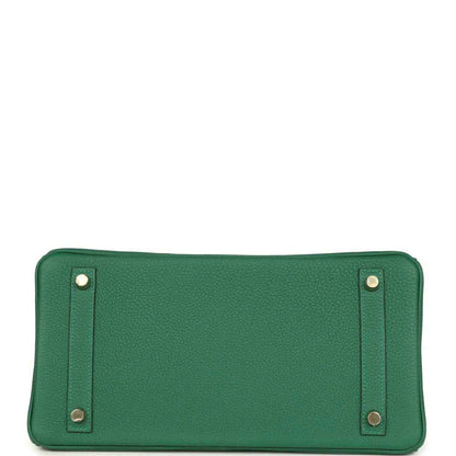 Green Togo leather zippered interior pocket with metal corner studs