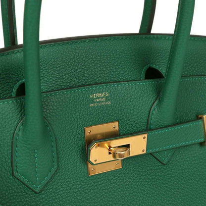 Hermes stamped green leather interior with gold turn-lock clasp detail