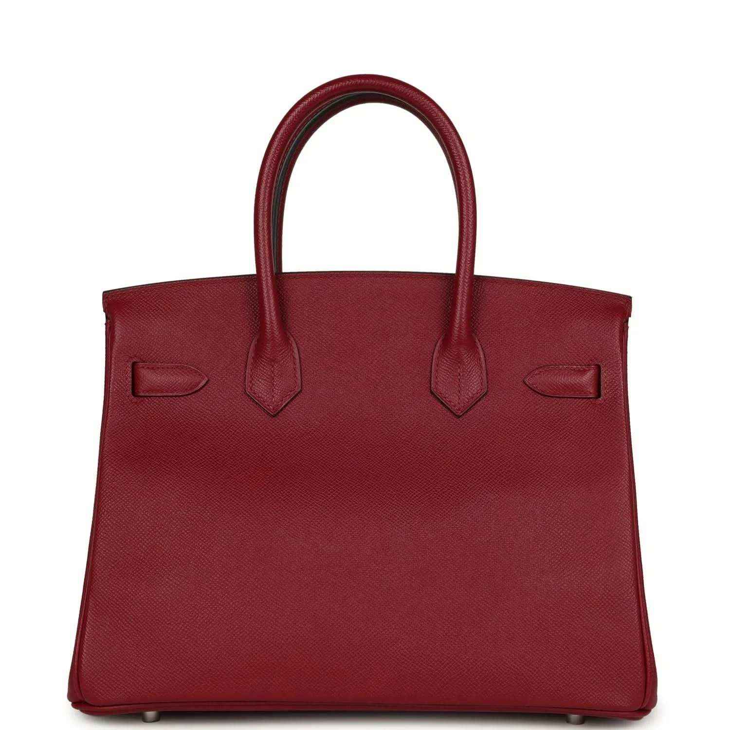 Red leather handbag with structured front, twin handles and silver hardware feet