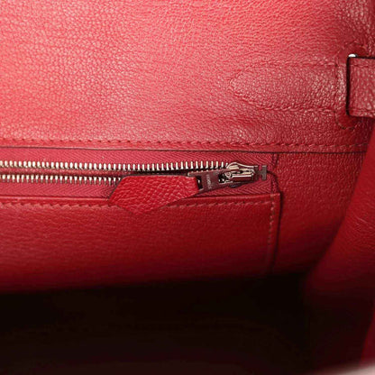 Red leather interior with zipper track and silver-tone zipper pull