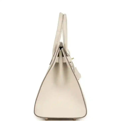 Light cream leather handbag with top handles and structured sides