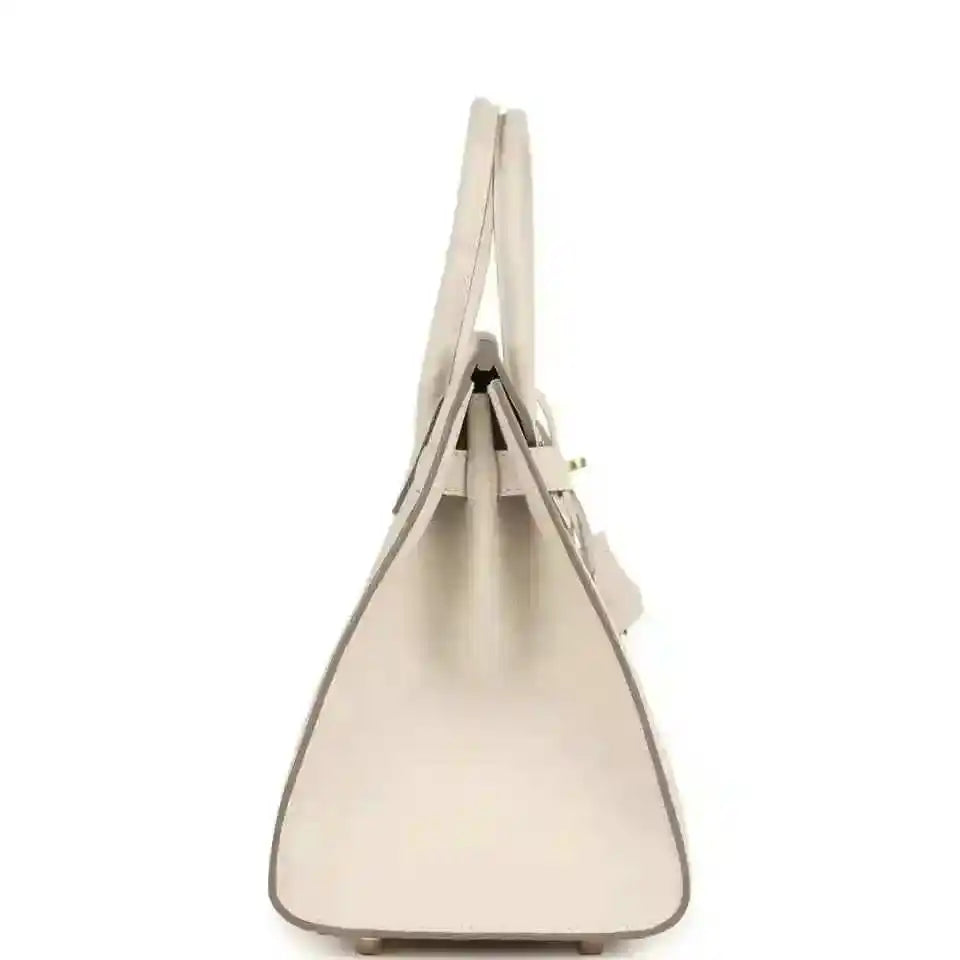 Light cream leather handbag with top handles and structured sides