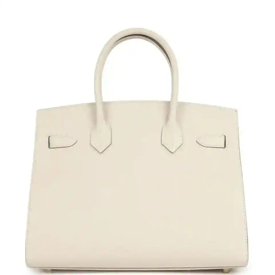 Light cream leather handbag with centered tab details and top handles
