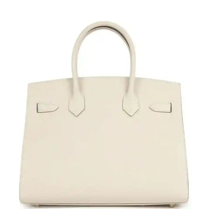 Light cream leather handbag with centered tab details and top handles