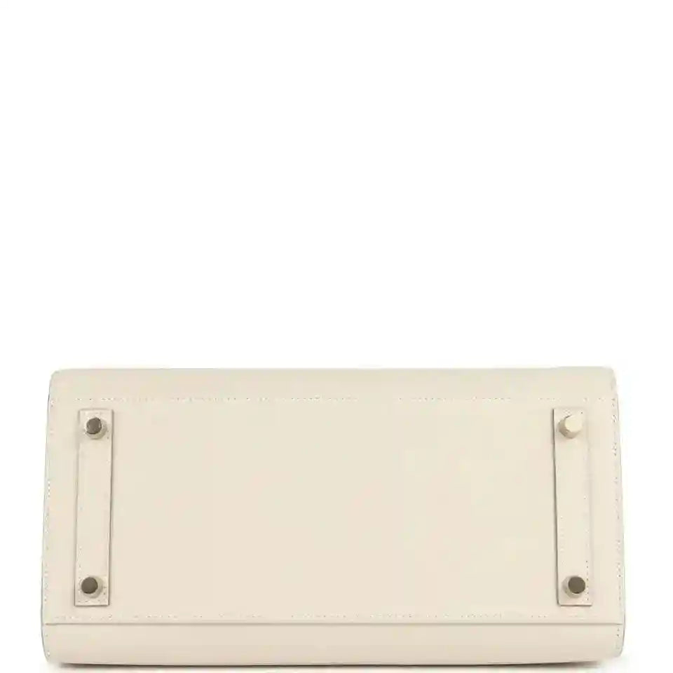 Light cream leather handbag with rear flap and stud hardware