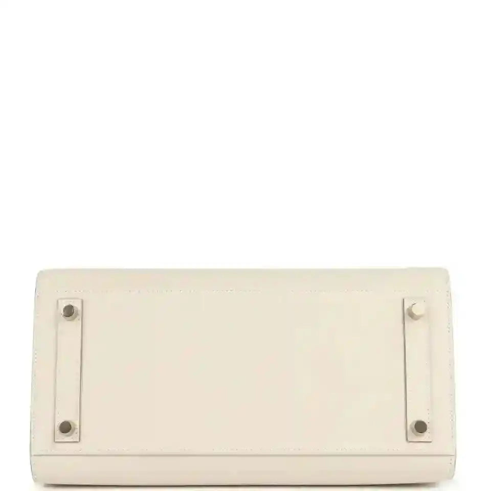 Light cream leather handbag with rear flap and stud hardware