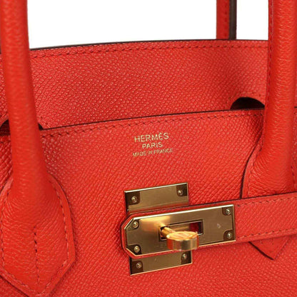 Hermes Birkin 30 interior view with red leather lining, stamp and gold lock plate