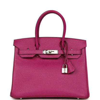 Rose-purple pebbled leather handbag with top handles and silver front lock clasp