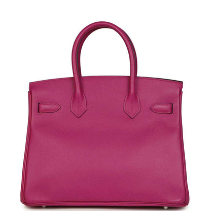 Rose-purple pebbled leather handbag front view with top handles and stitched flap details