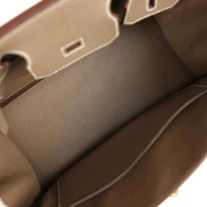 Taupe leather Birkin interior with stitched trim and inner slip pocket.