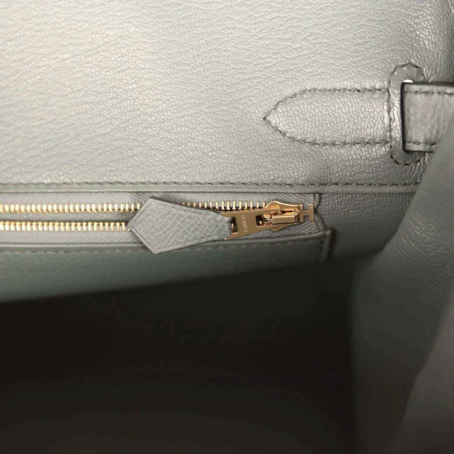 Hermes Birkin 30 interior pocket with gold zipper pull on green leather lining