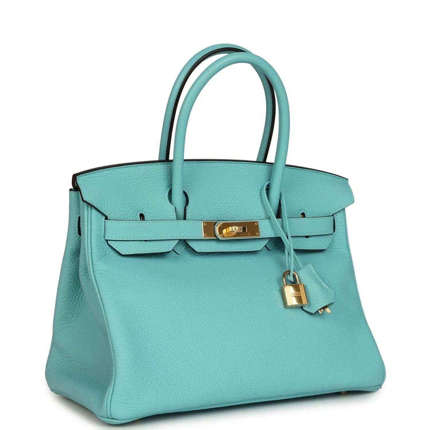 Teal leather handbag with top handles, front belt strap with gold-tone bar, and hanging lock