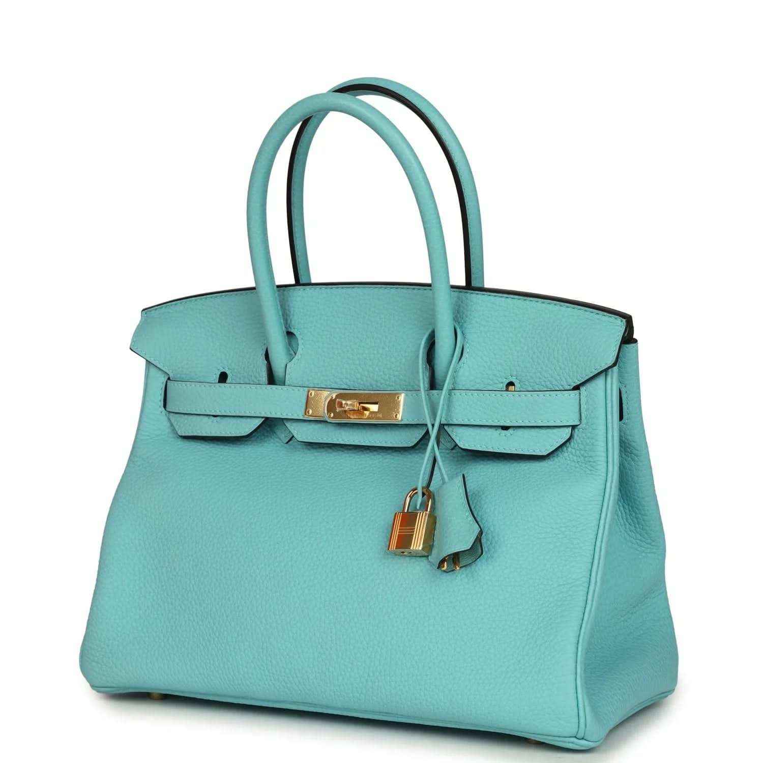 Teal leather handbag with gold-tone front strap, top handles, and padlock charm