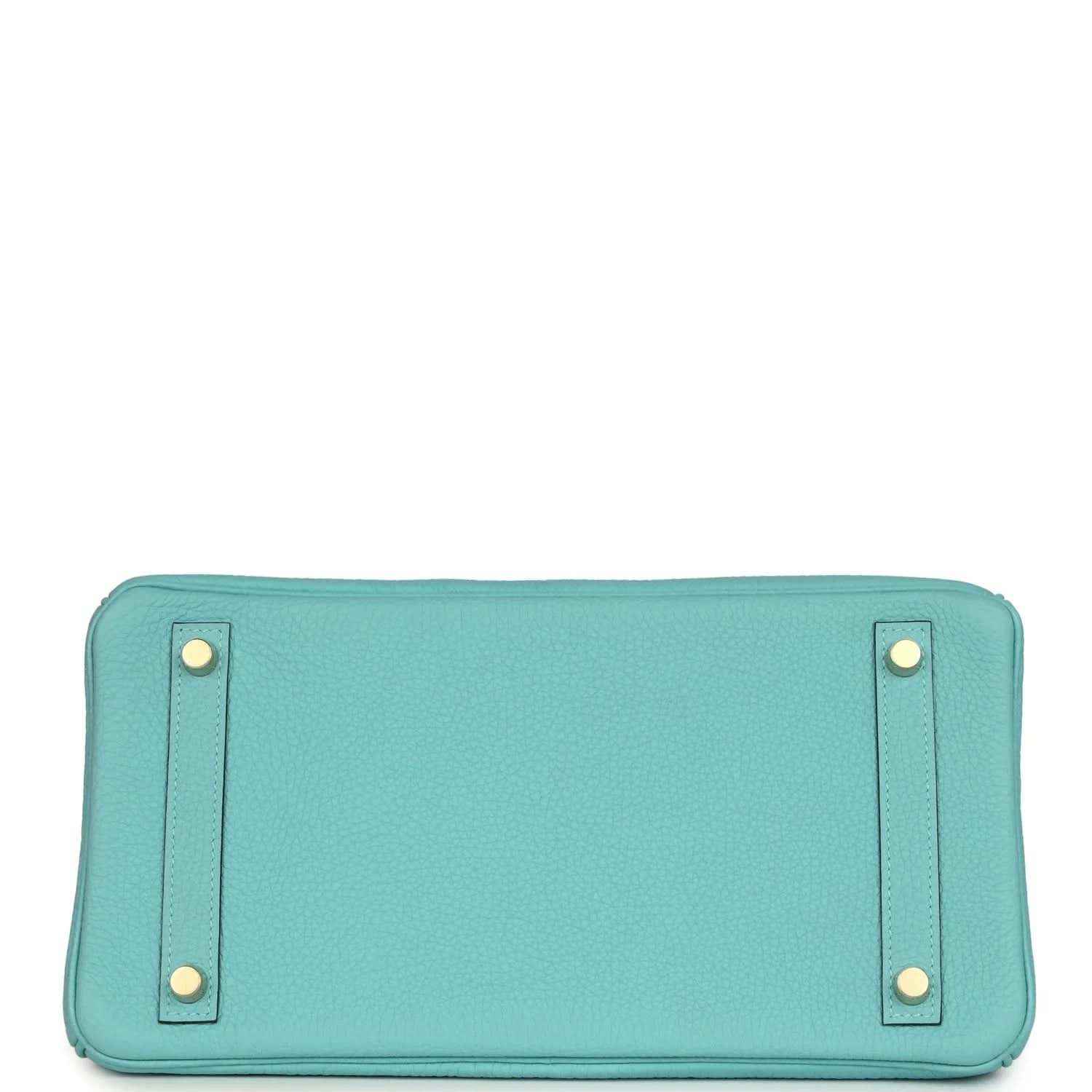 Teal leather handbag base with four corner feet, stitched edges, and snap-tab hardware