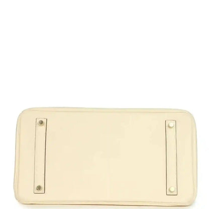 Cream leather rectangular base with two metal corner rings