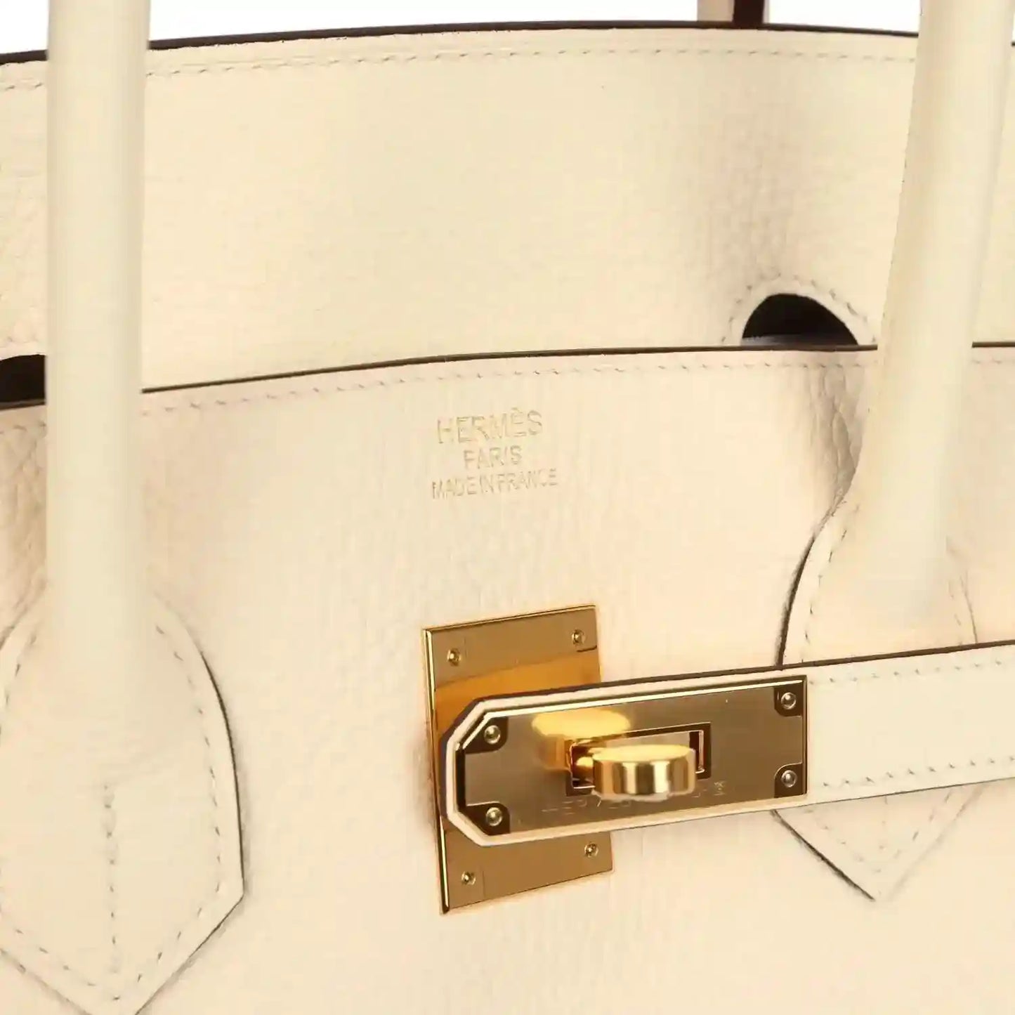 Hermès logo on cream leather with gold turn-lock hardware