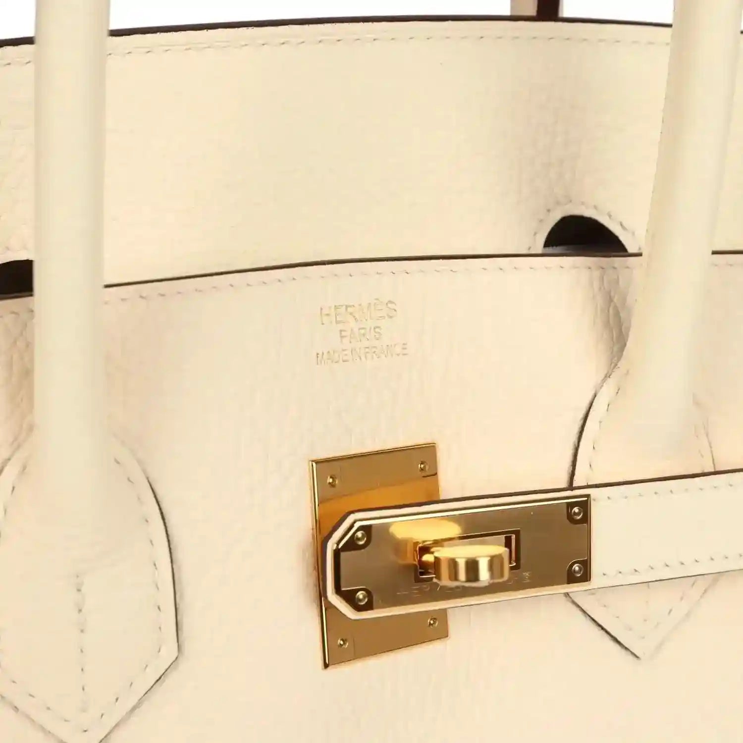 Hermès logo on cream leather with gold turn-lock hardware