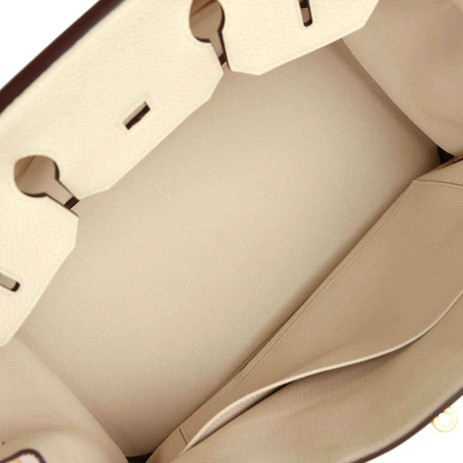 Cream leather handbag interior with smooth lining and open top