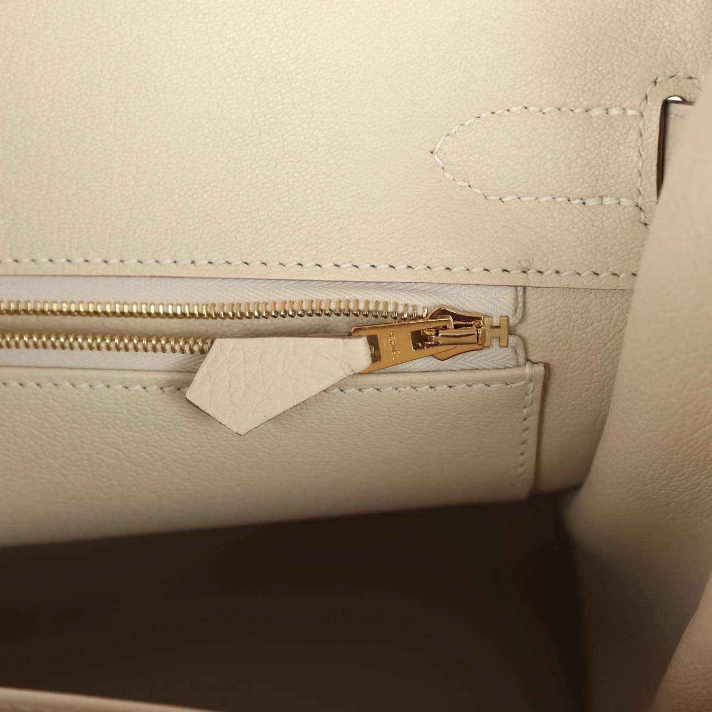 Hermes Birkin 30 handbag zipper detail in light cream leather with gold pull