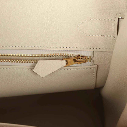 Hermes Birkin 30 handbag zipper detail in light cream leather with gold pull