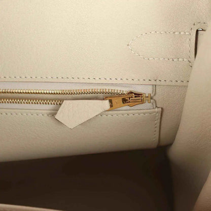 Hermes Birkin 30 handbag zipper detail in light cream leather with gold pull