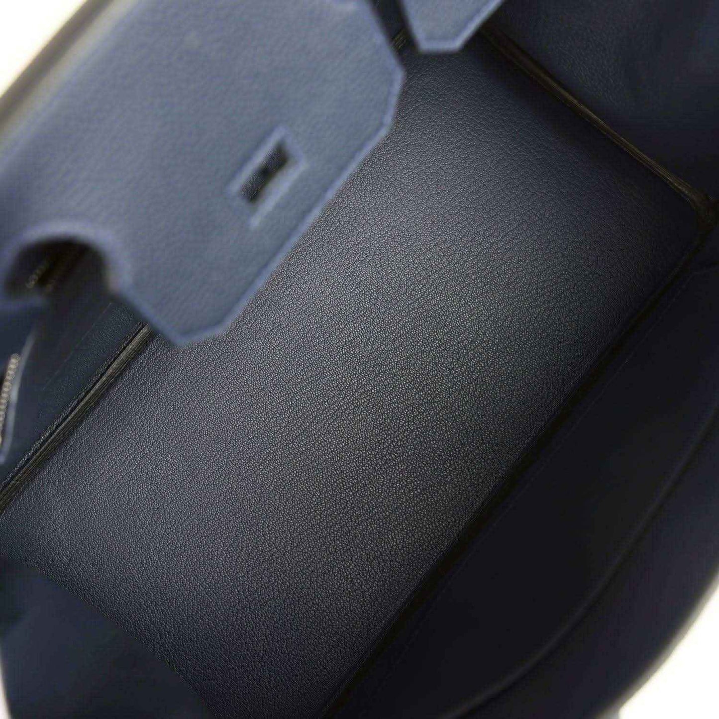Blue leather Birkin 30 handbag interior with stitched edges and fold-over area