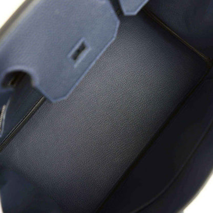 Blue leather Birkin 30 handbag interior with stitched edges and fold-over area
