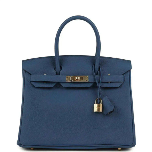 Blue Birkin 30 handbag in textured Togo leather with top handle and gold-tone clasp