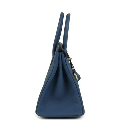 Blue Birkin 30 handbag with top handles, shown in a side profile