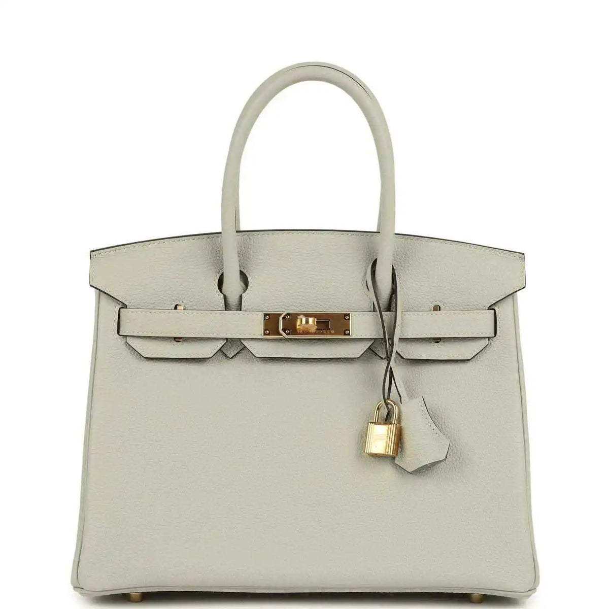 Light gray structured leather handbag with top handles, front flap, and gold lock clasp