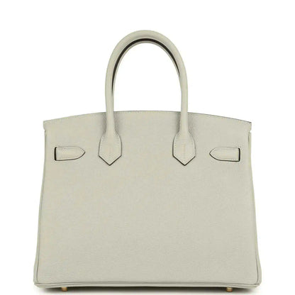 Light gray structured leather handbag with top handles and front flap details