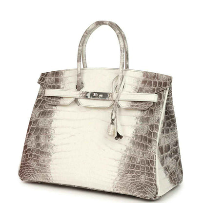 Ivory crocodile-textured top-handle handbag with front flap, latch, and key charm
