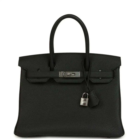Black leather Birkin-style handbag with top handles, front flap and lock clasp detail.