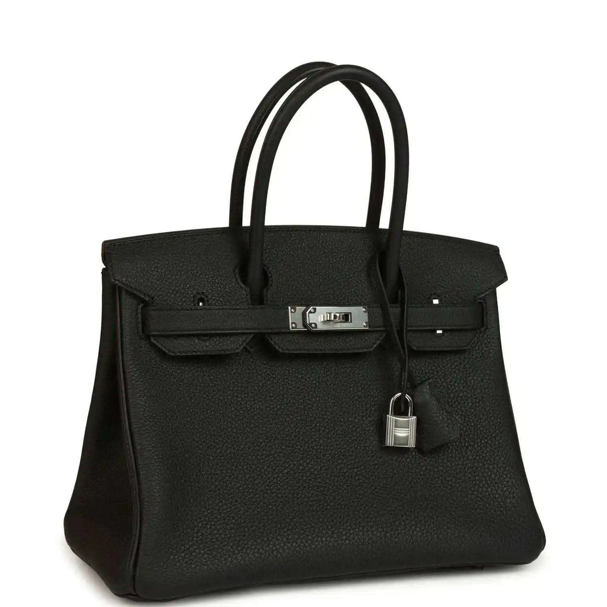 Black leather handbag with top handles, front flap and hanging lock charm on strap.