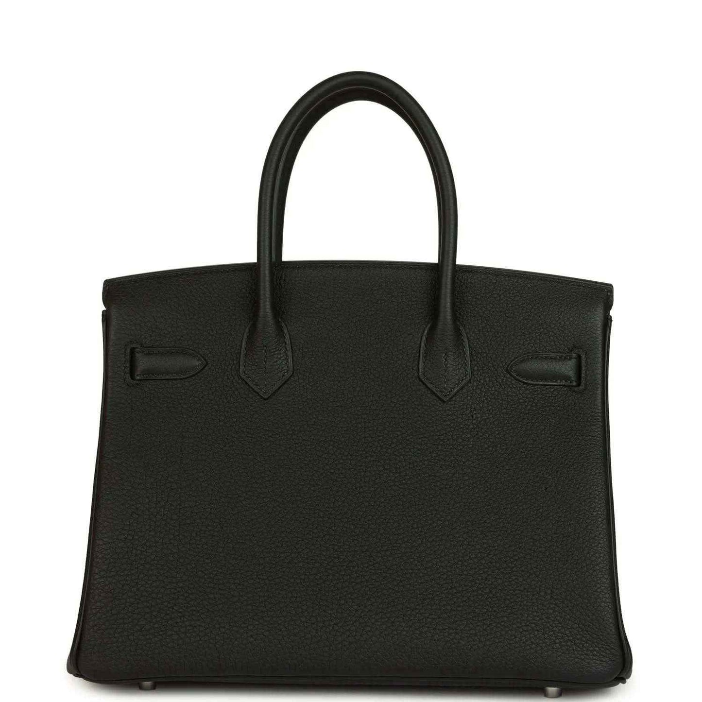 Black leather handbag front with top handles, stitched seams and flap pocket detailing.