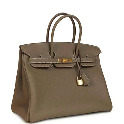 Taupe Birkin 35 handbag with gold-tone turn-lock and hanging key charm, pebbled leather