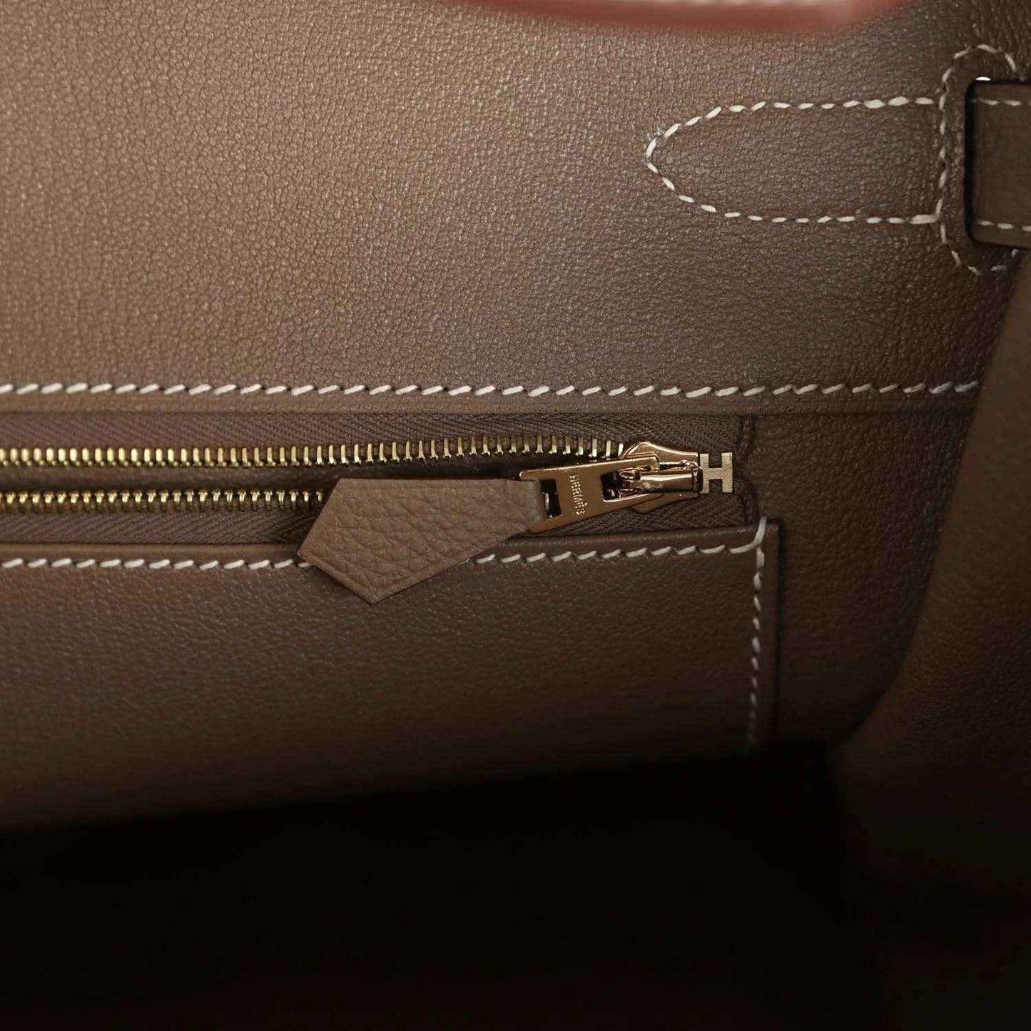 Birkin 35 handbag interior zipper pocket with gold-tone zipper pull and stitched seams