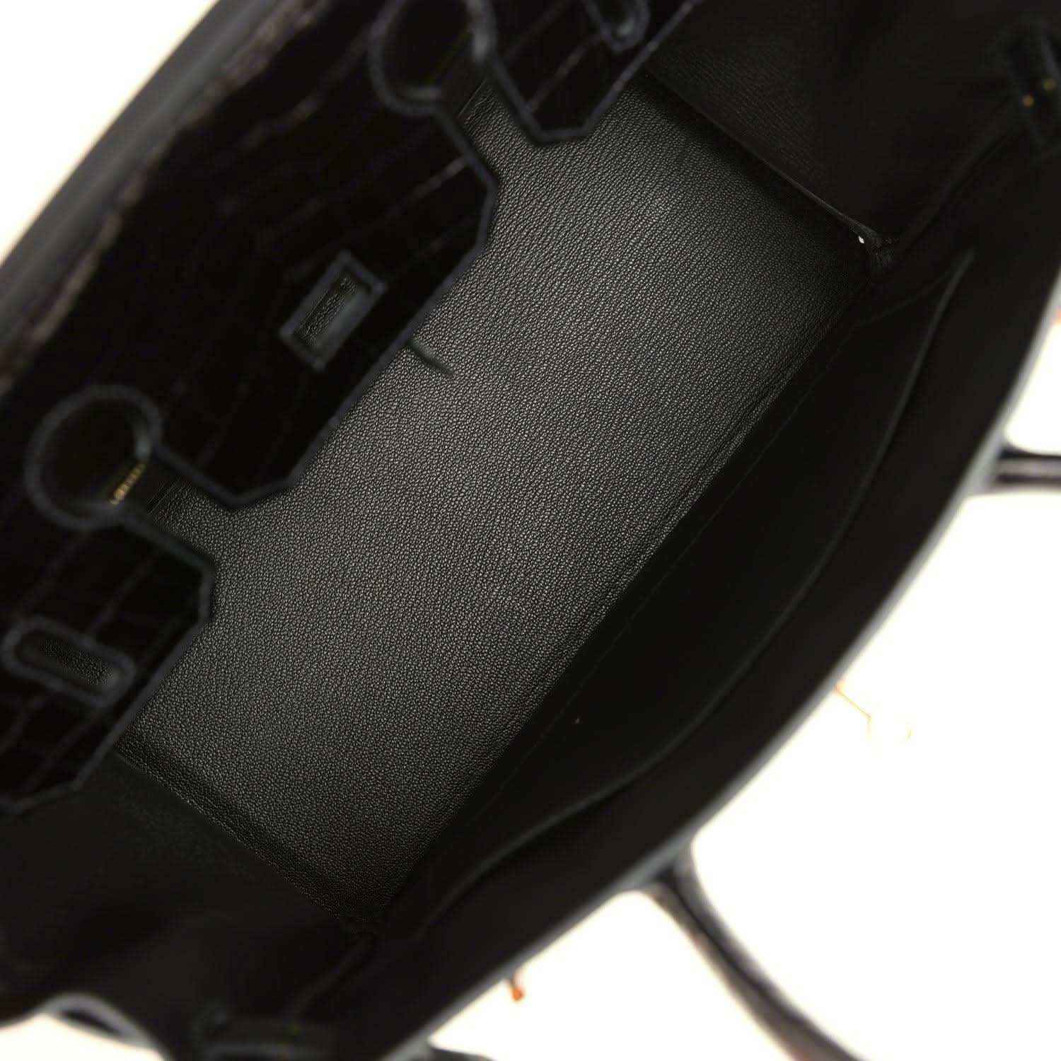 Dark green leather handbag interior with stitched lining and inner pocket