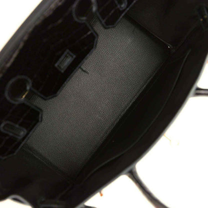 Dark green leather handbag interior with stitched lining and inner pocket